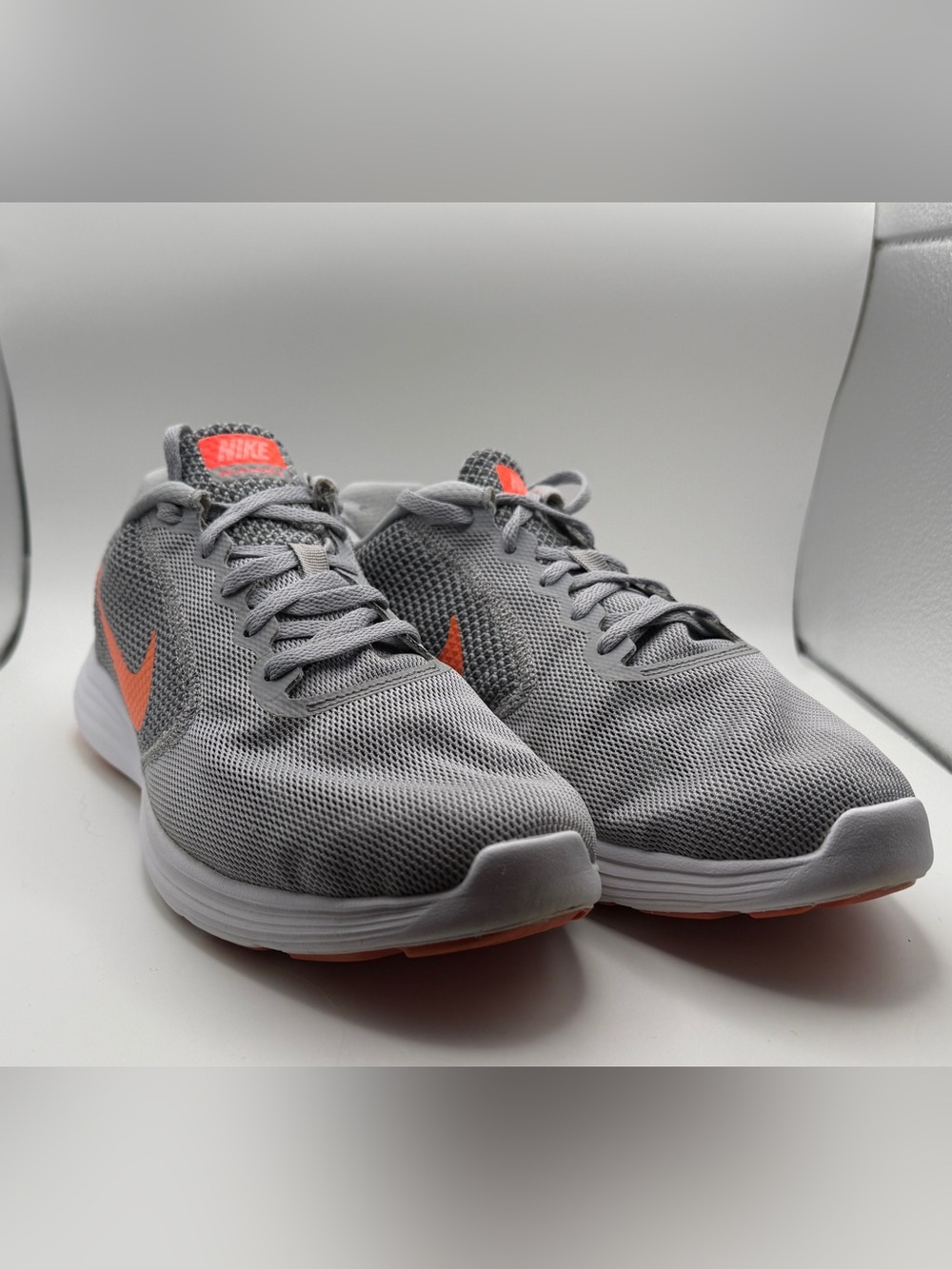 Nike Men’s Light Gray Mesh Running Sneakers with Orange Swoosh